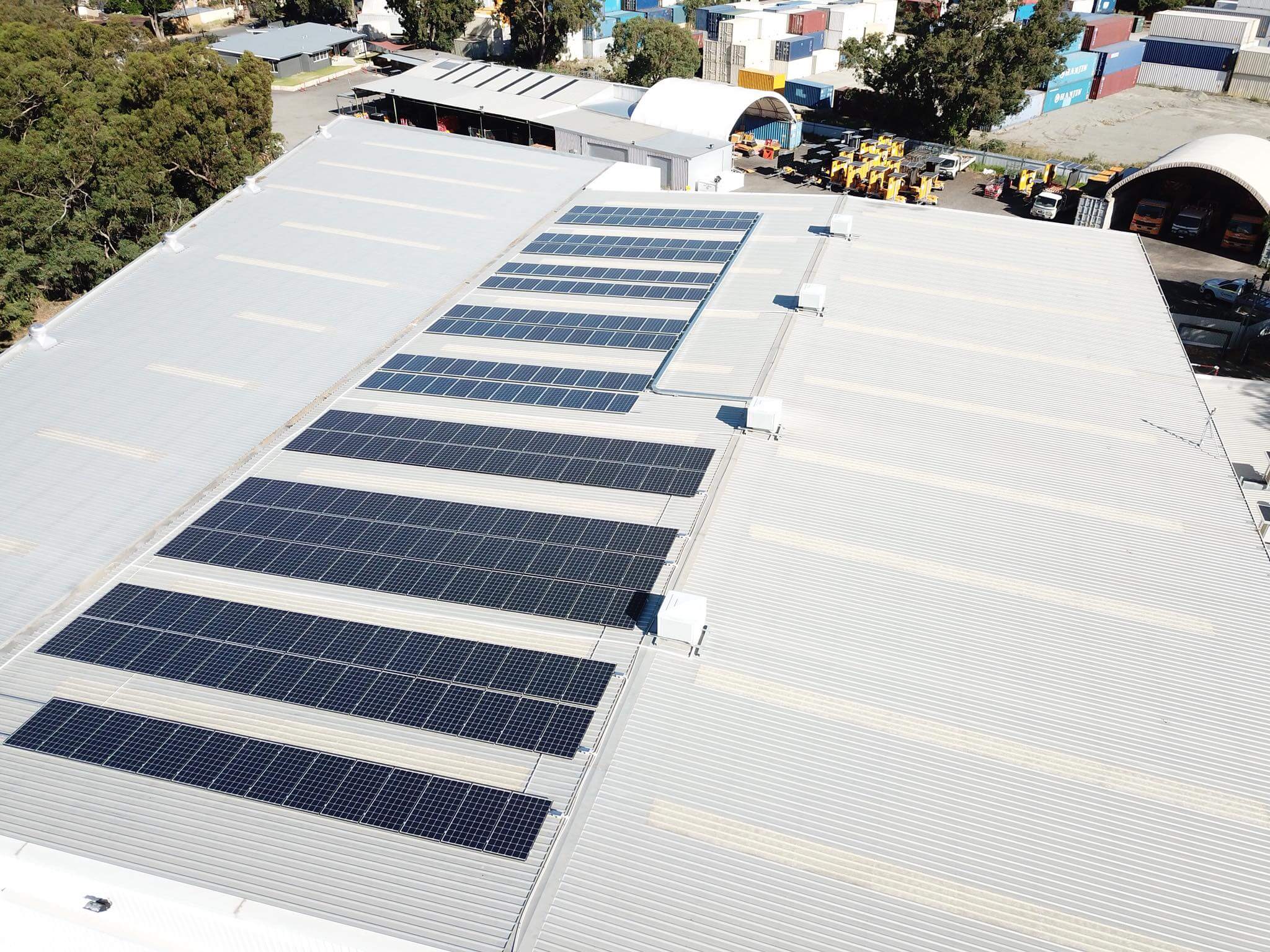 comercial solar atop flat roofed property